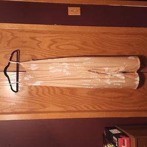 Patterned jumpsuit with adjustable straps and pockets